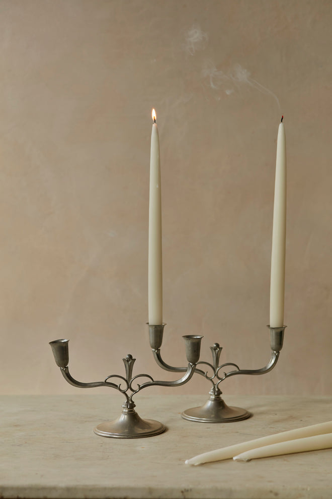 A pair of Swedish pewter candlesticks