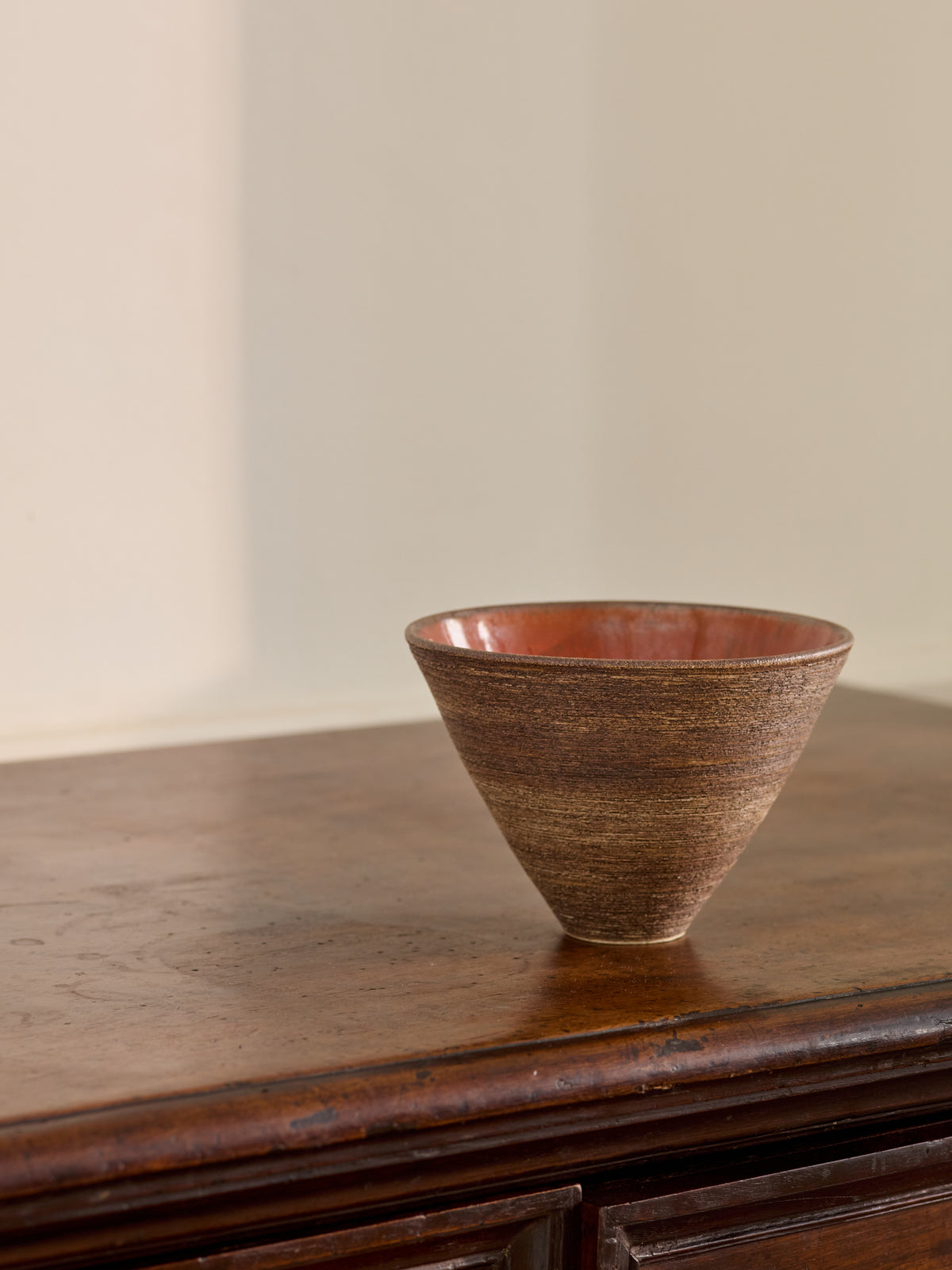 A Fluted Ceramic Bowl with Red Glazed Interior