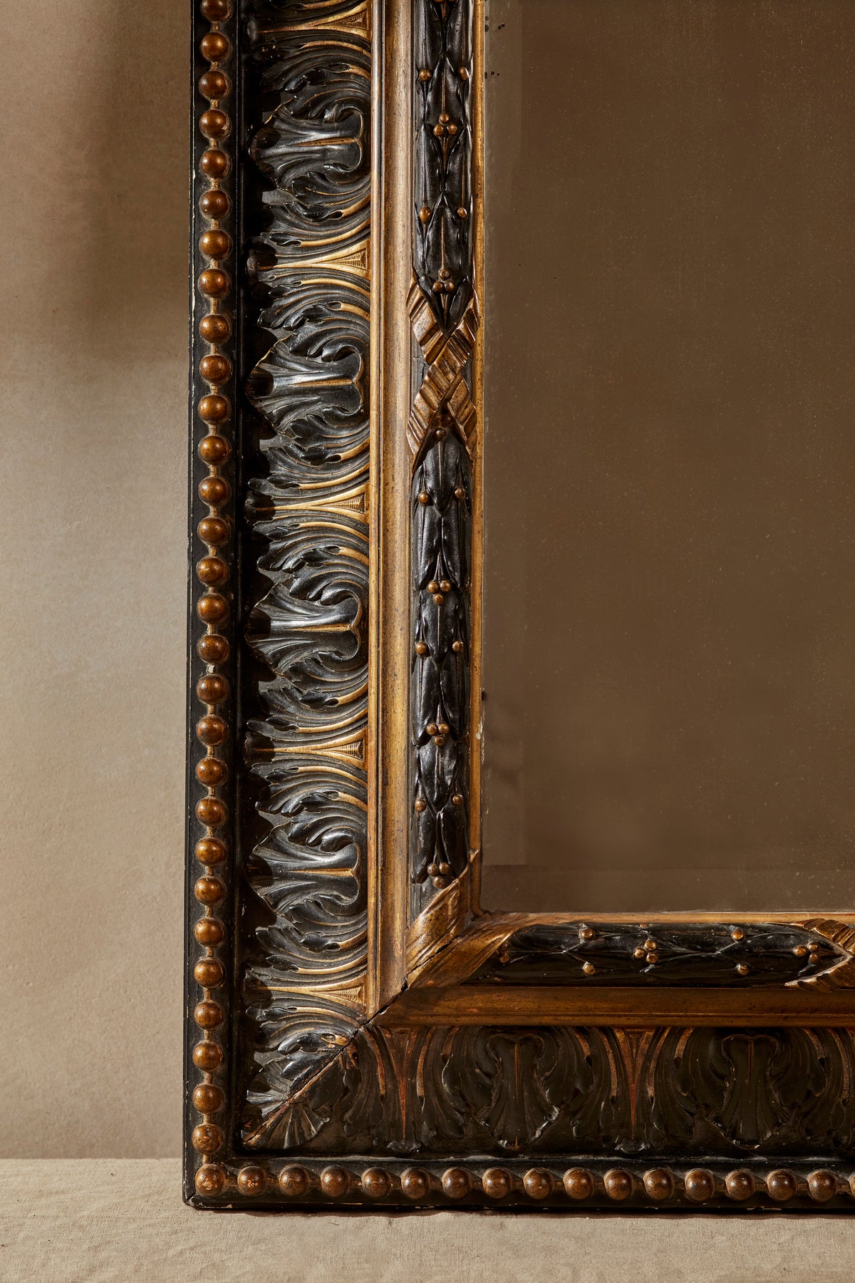 Carved 20th Century Ebonised & Gilt Mirror