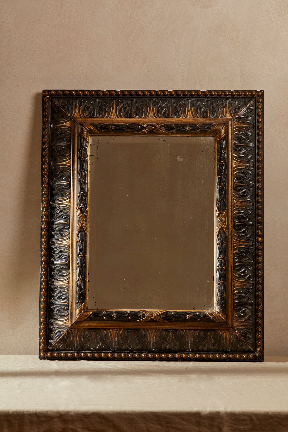 Carved 20th Century Ebonised & Gilt Mirror