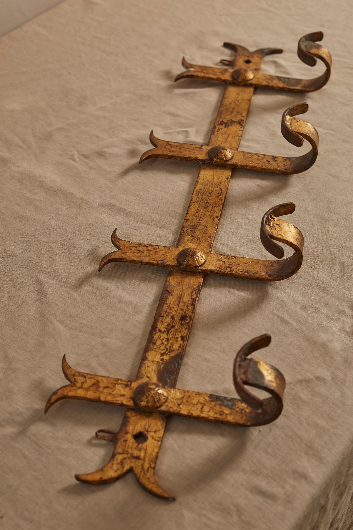A Hammered Gilt Iron Coat Hook