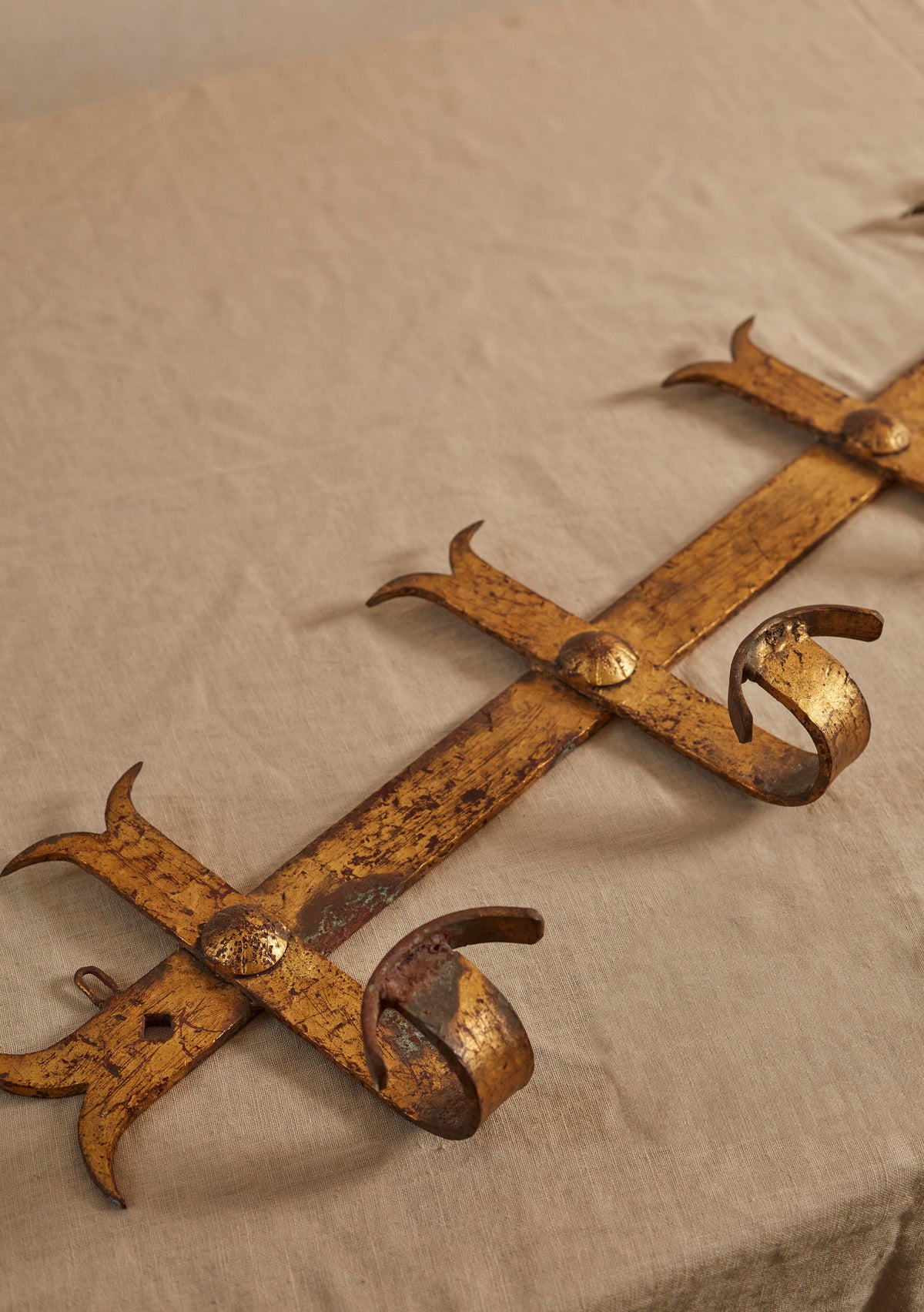 A Hammered Gilt Iron Coat Hook