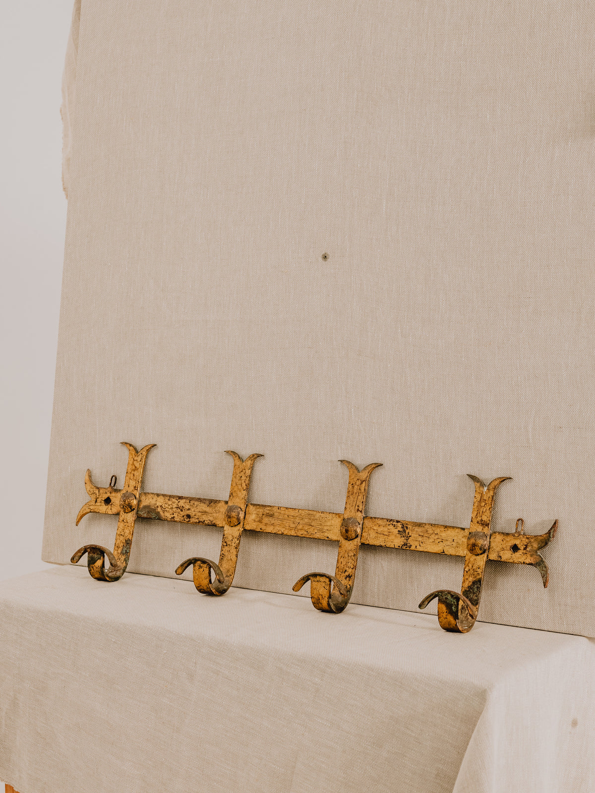 A Hammered Gilt Iron Coat Hook