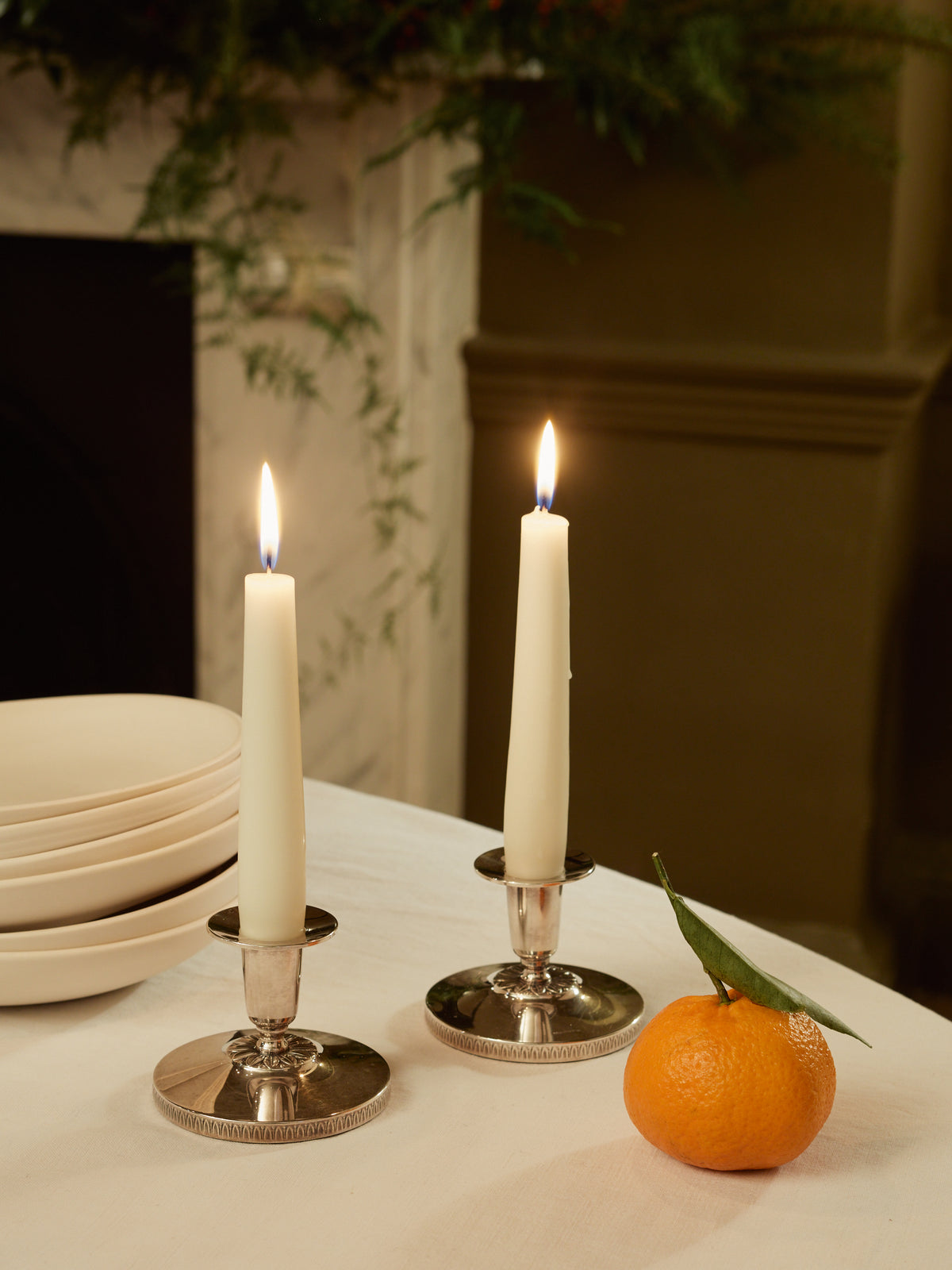 A Pair of Silver Candlesticks with Floral Motif