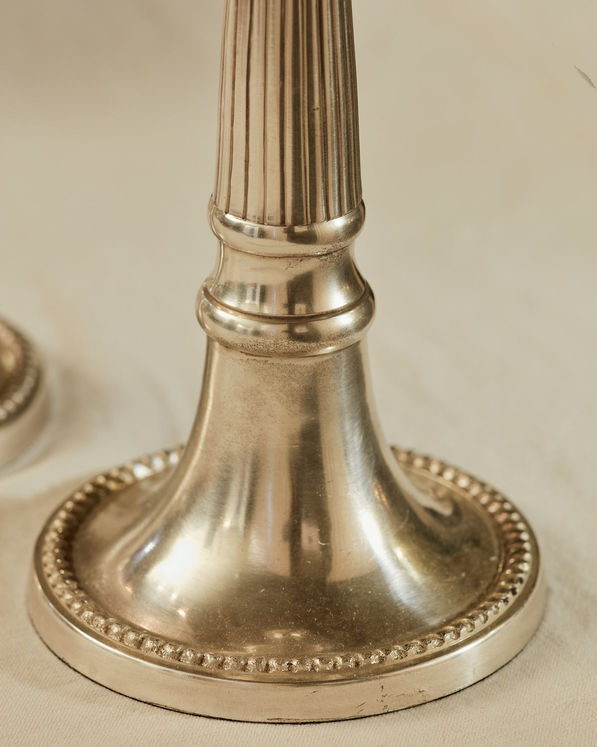 A pair of Reeded Pillar Candlesticks