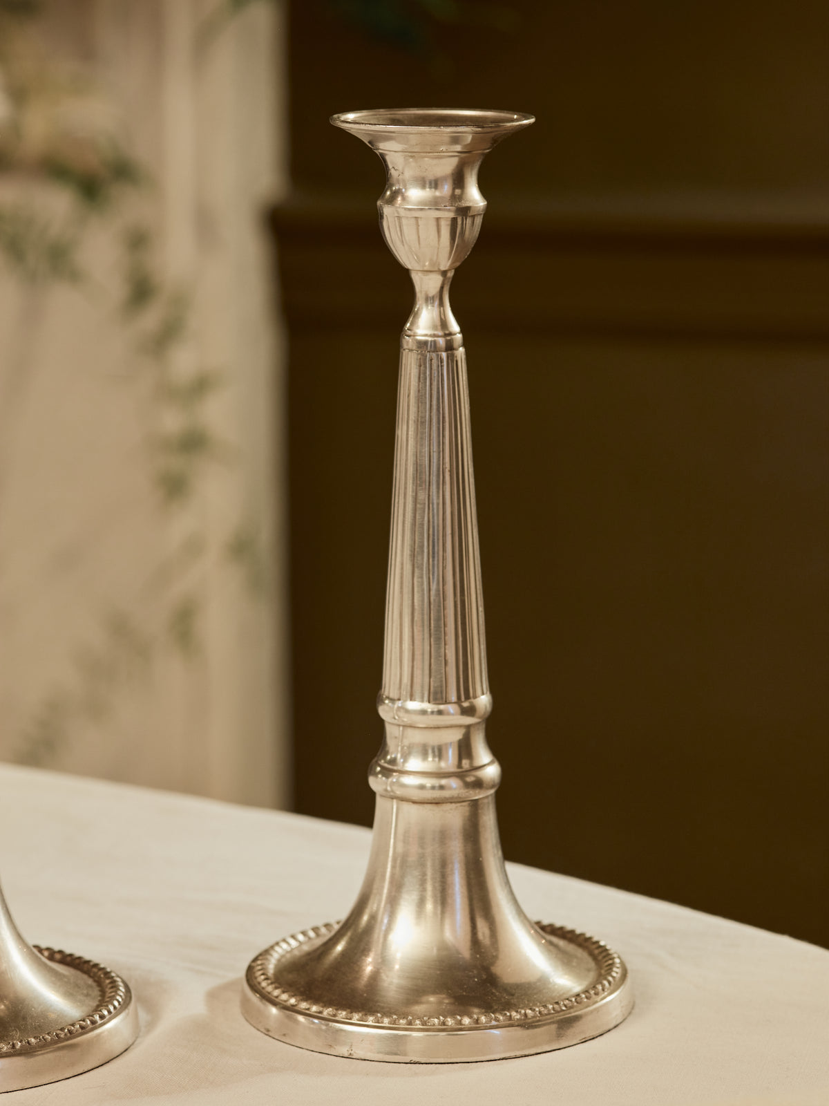 A pair of Reeded Pillar Candlesticks