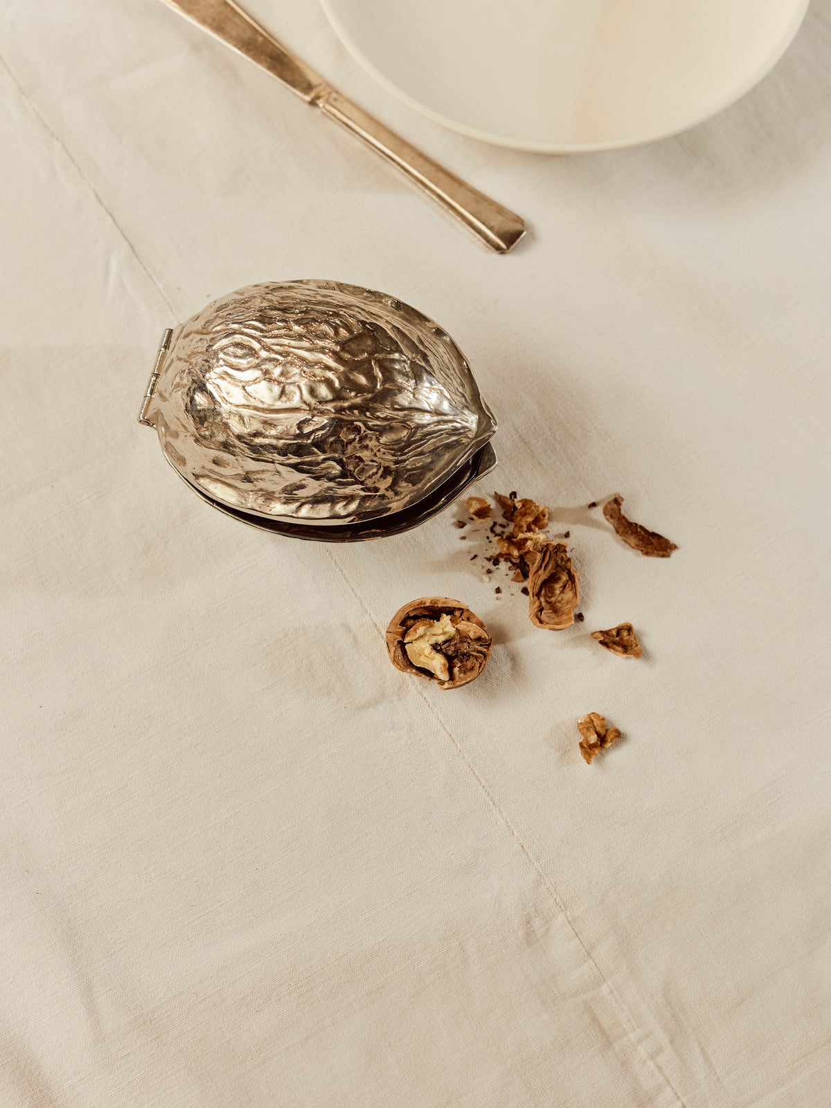 A Walnut Shaped Cracker in Brass