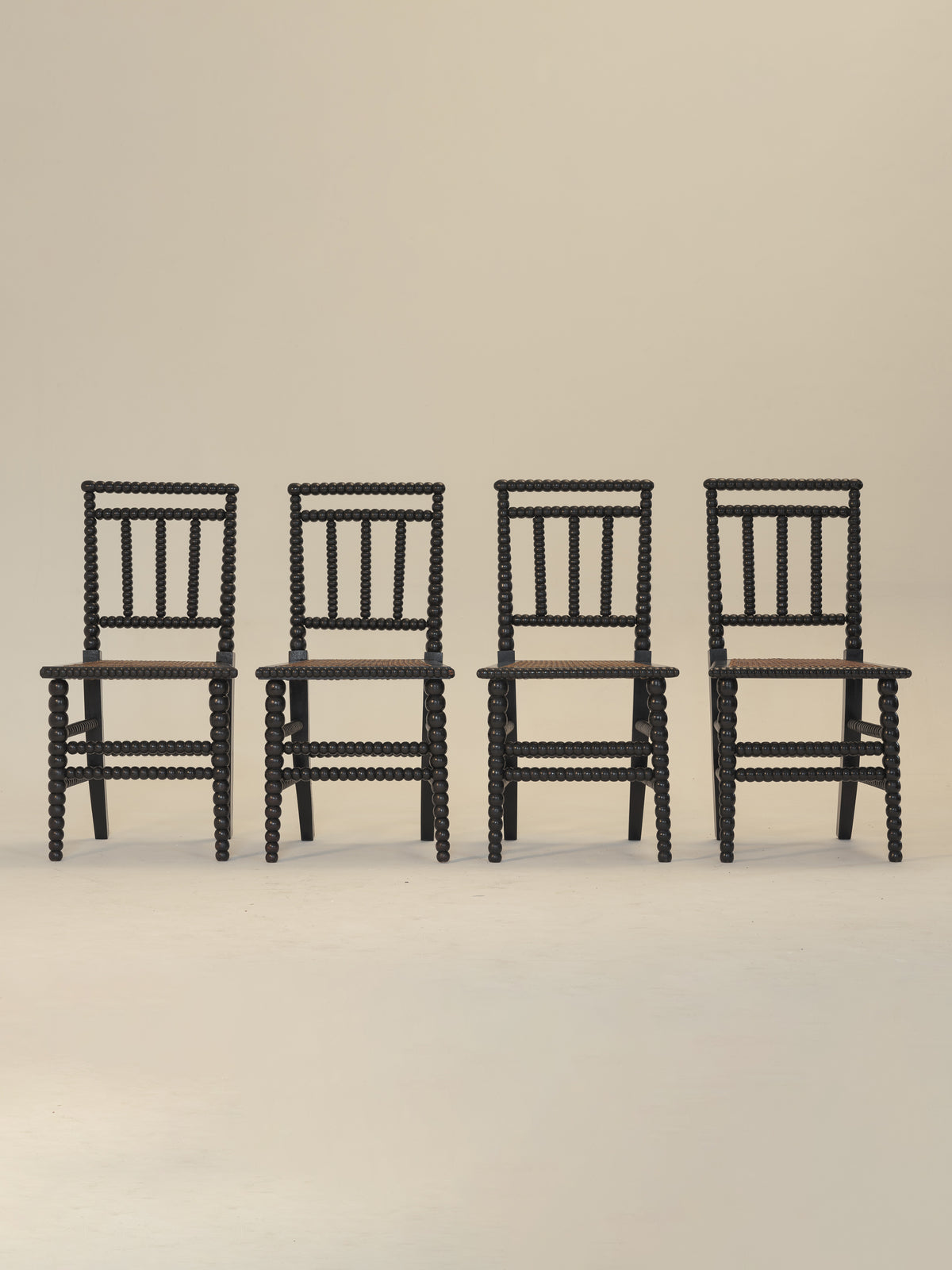 Set of Eight Ebonised Bobbin Chairs